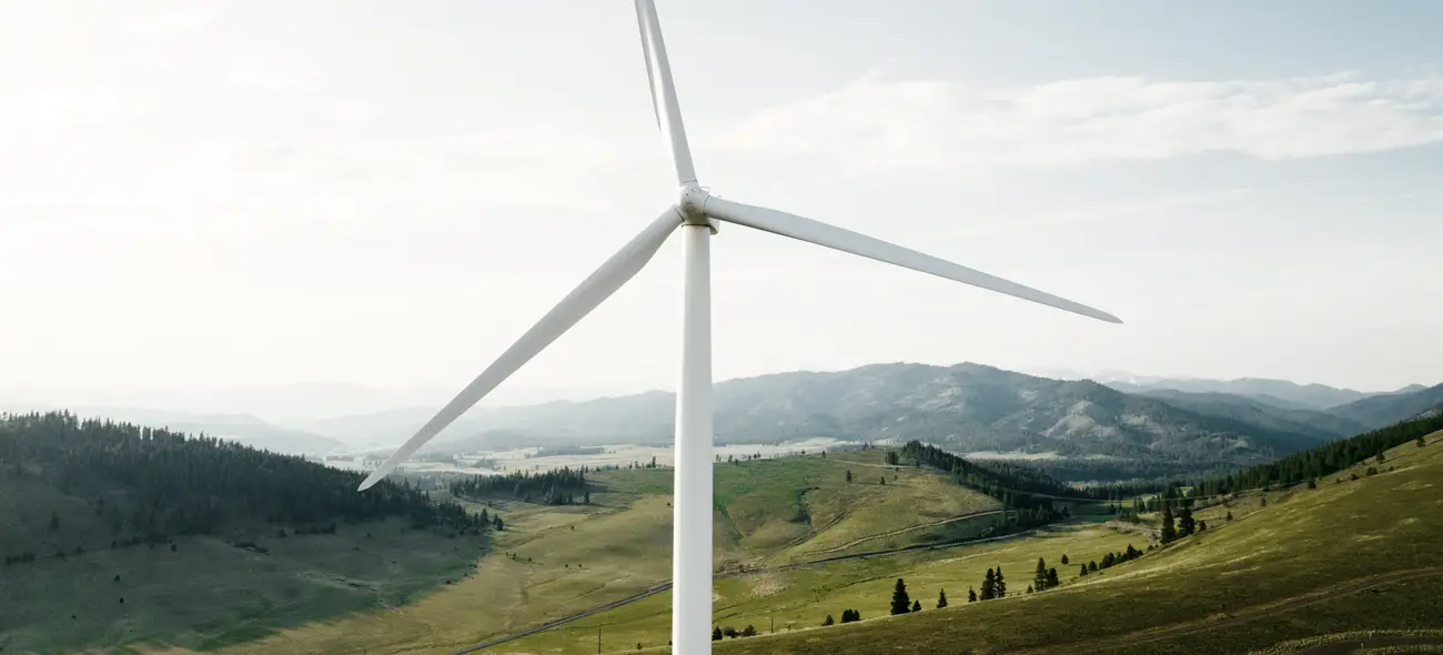 Wind turbine in misty morning landscape. Wind turbine in misty morning landscape.